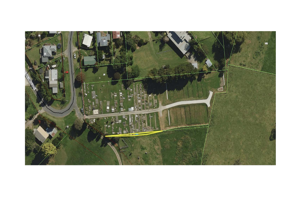Aerial view of a cemetery

Description automatically generated