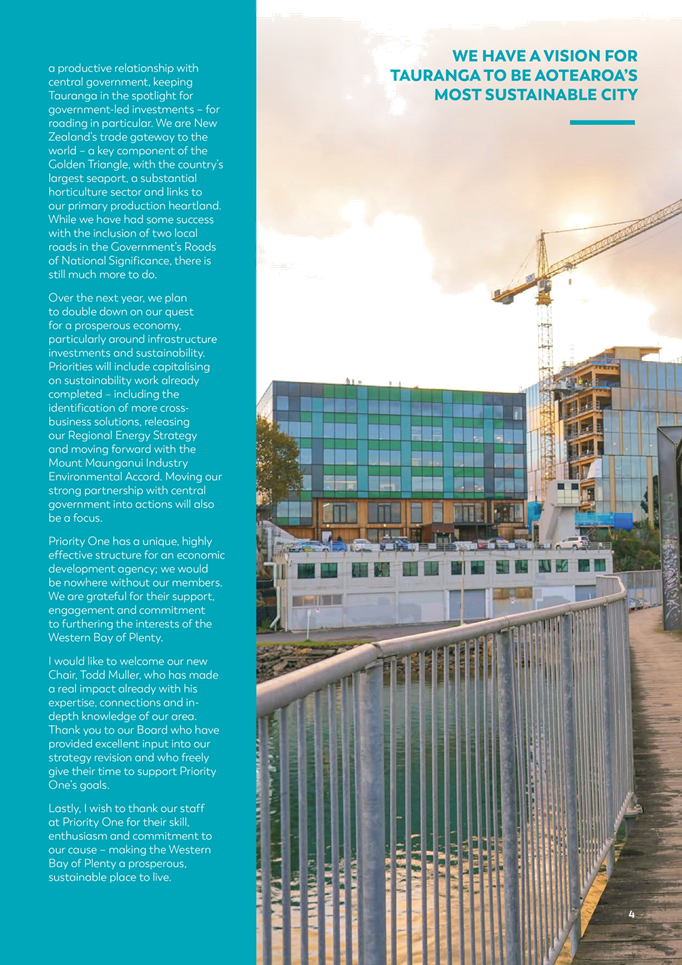 A bridge with a crane in the background

Description automatically generated