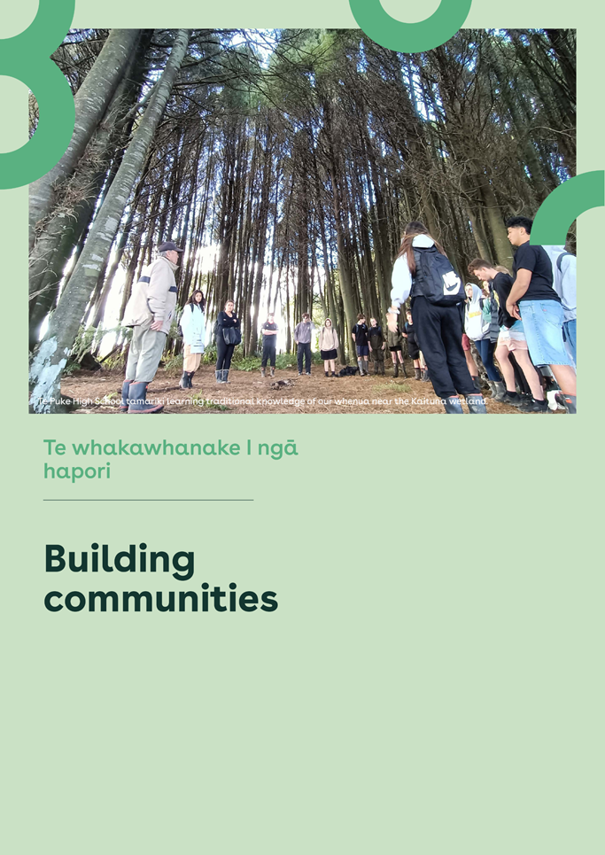 A group of people standing under a tree

Description automatically generated