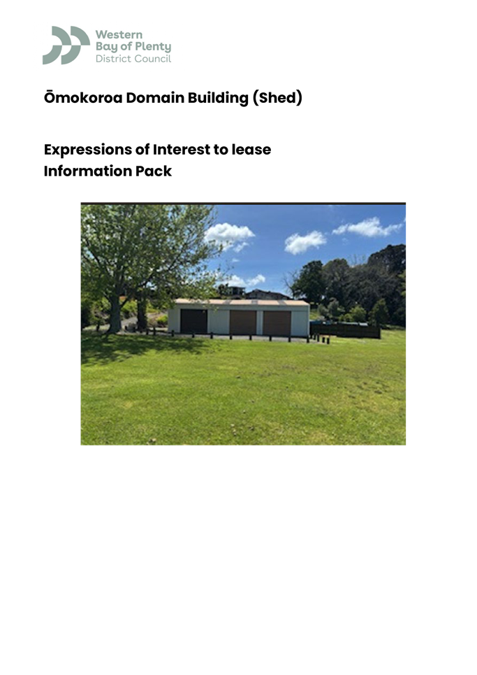 A building in a grassy field

Description automatically generated