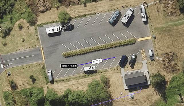 Aerial view of a parking lot

Description automatically generated