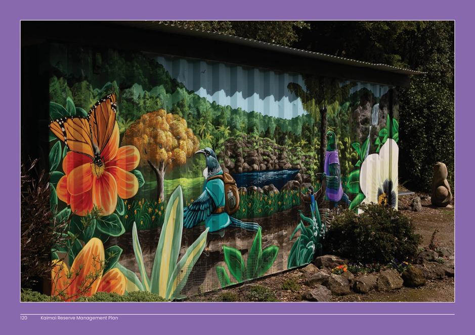 A painted metal container with flowers and plants

AI-generated content may be incorrect.