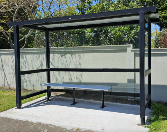 A metal bench in a shelter